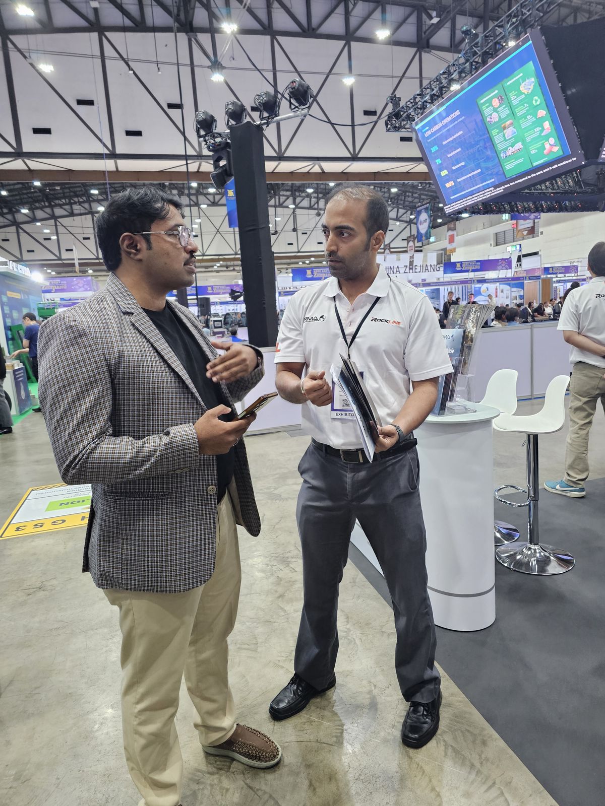 Business discussion between a GVTO representative and an exhibitor on the BCT Expo 2026 show floor