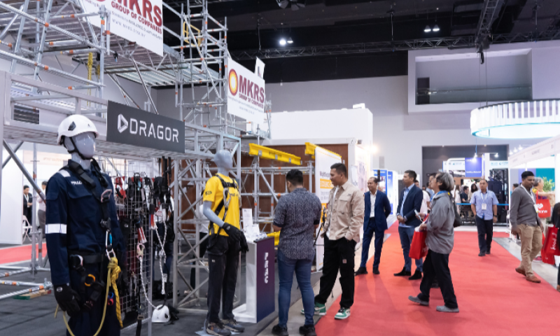 Exhibitors and visitors exploring scaffolding, safety equipment and machinery stands on the BuildXpo Malaysia exhibition floor